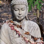 Light Stone Buddha with Old Leis